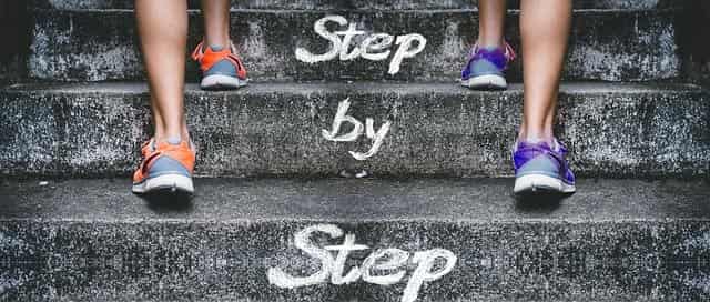two people climbing stairs step by step become a goal achiever and achieve big goals