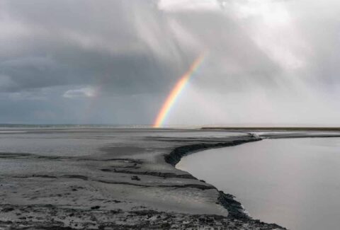 narcissistic abuse and spiritual awakening represented by rainbow shining through clouds