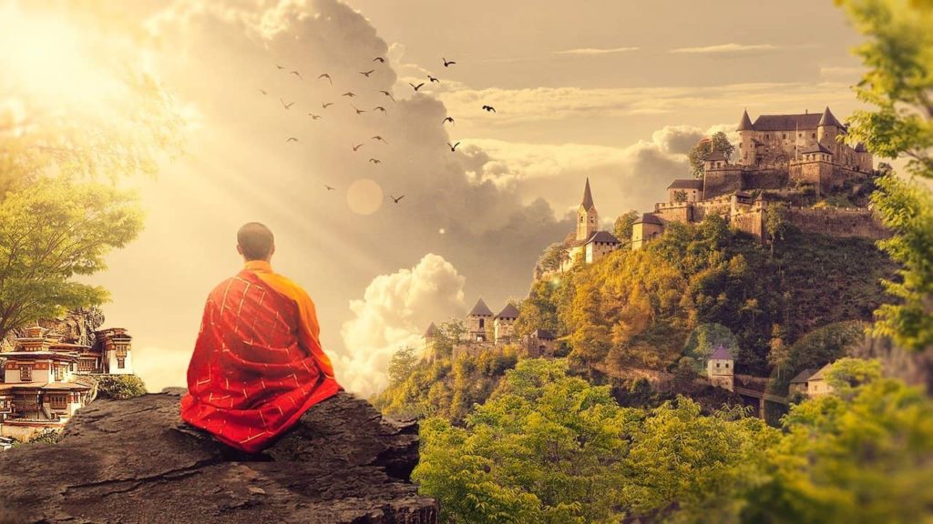 buddha monk meditating in front of beautiful view of castle, clouds and nature