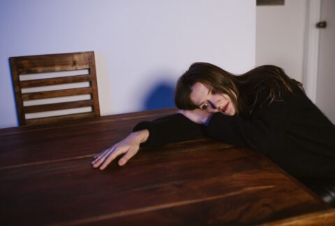 Girl crying on table