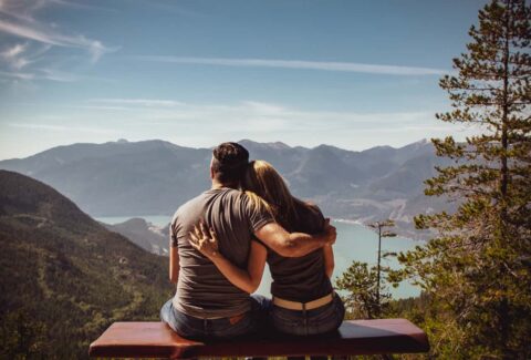 interdependent couple looking at mountain