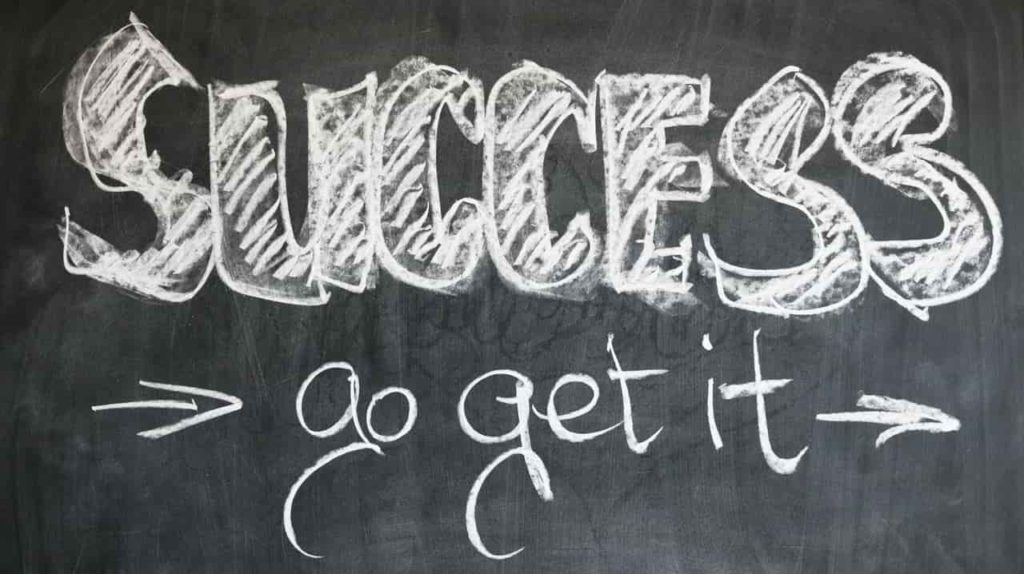 success go get it written on black board with white chalk