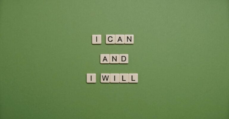 I can and I will written down by scrabble on a green background