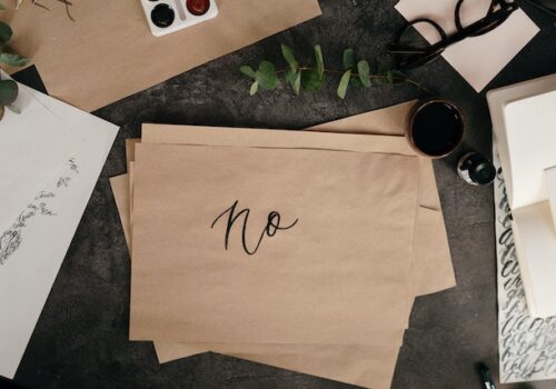 envelope with a "no" written on it to establish boundaries