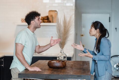 Demonstration of the importance of emotional intelligence in relationships as the photo shows a couple of male and female arguing in their dining room