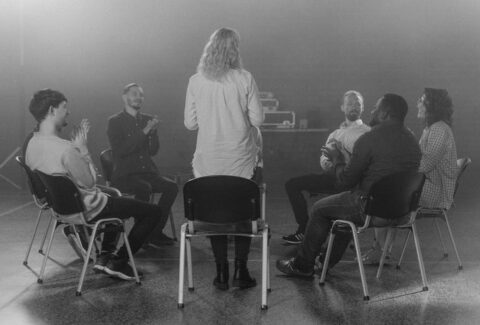 group therapy for narcissistic abuse: A group of people sitting on a chair in a circle supporting each other