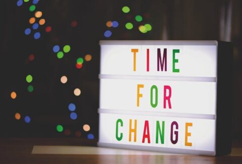 "time for change" written in colours